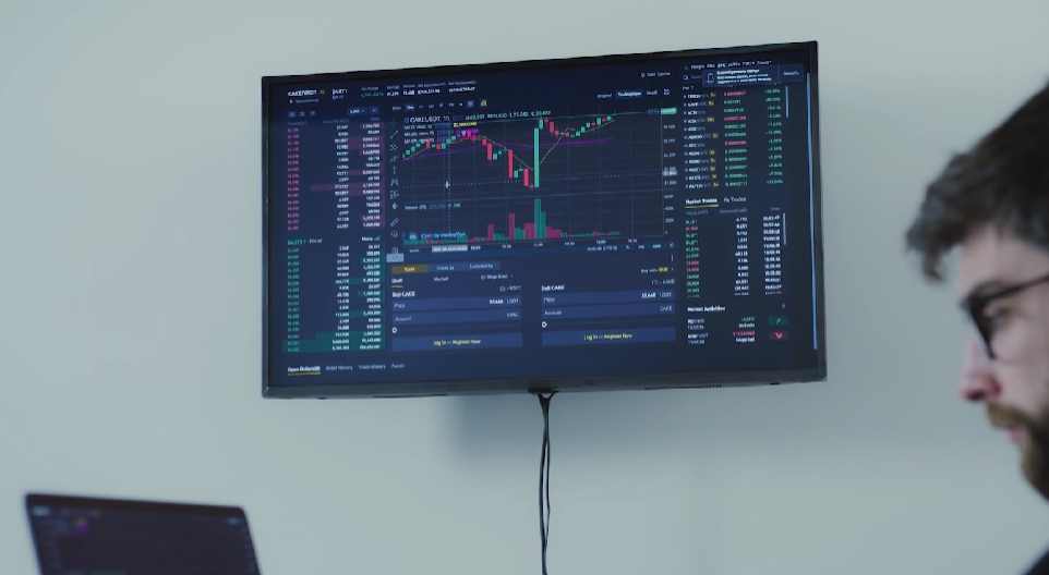 monitor showing cryptocurrency movement graphs